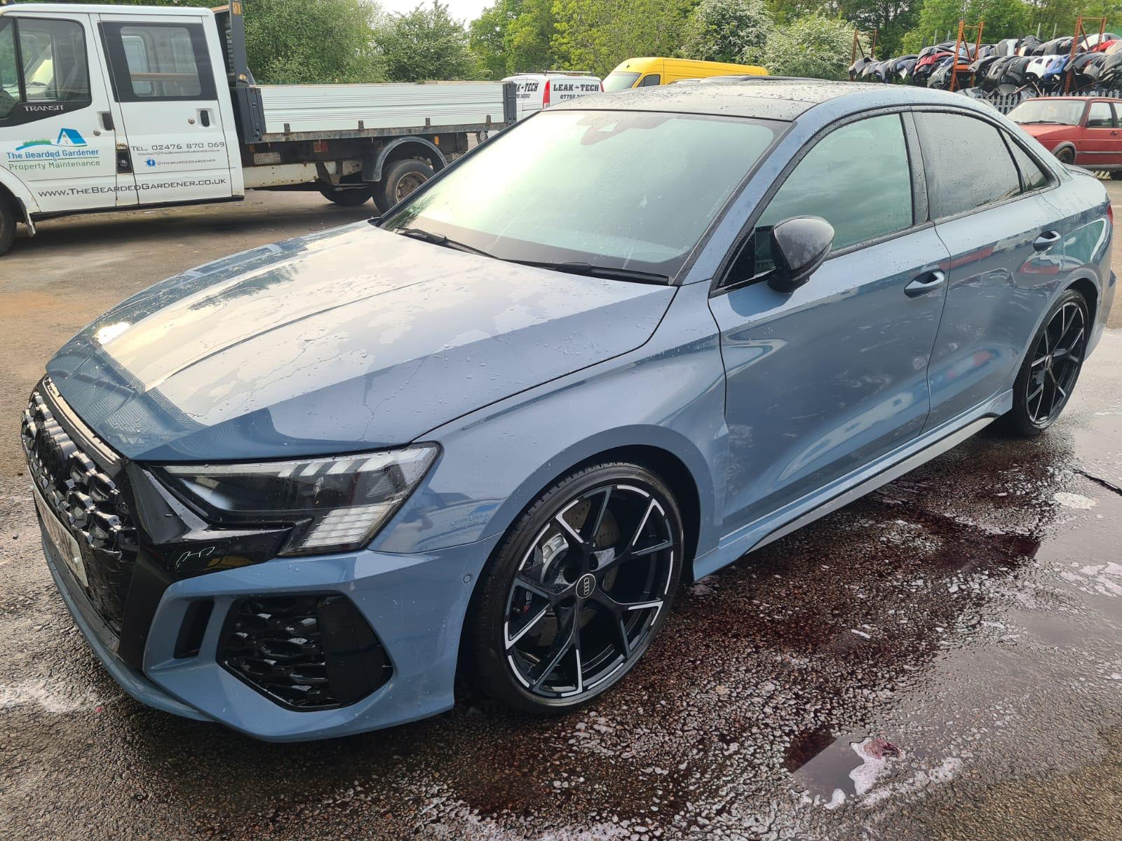 Rainwater sliding off a ceramic coated Audi